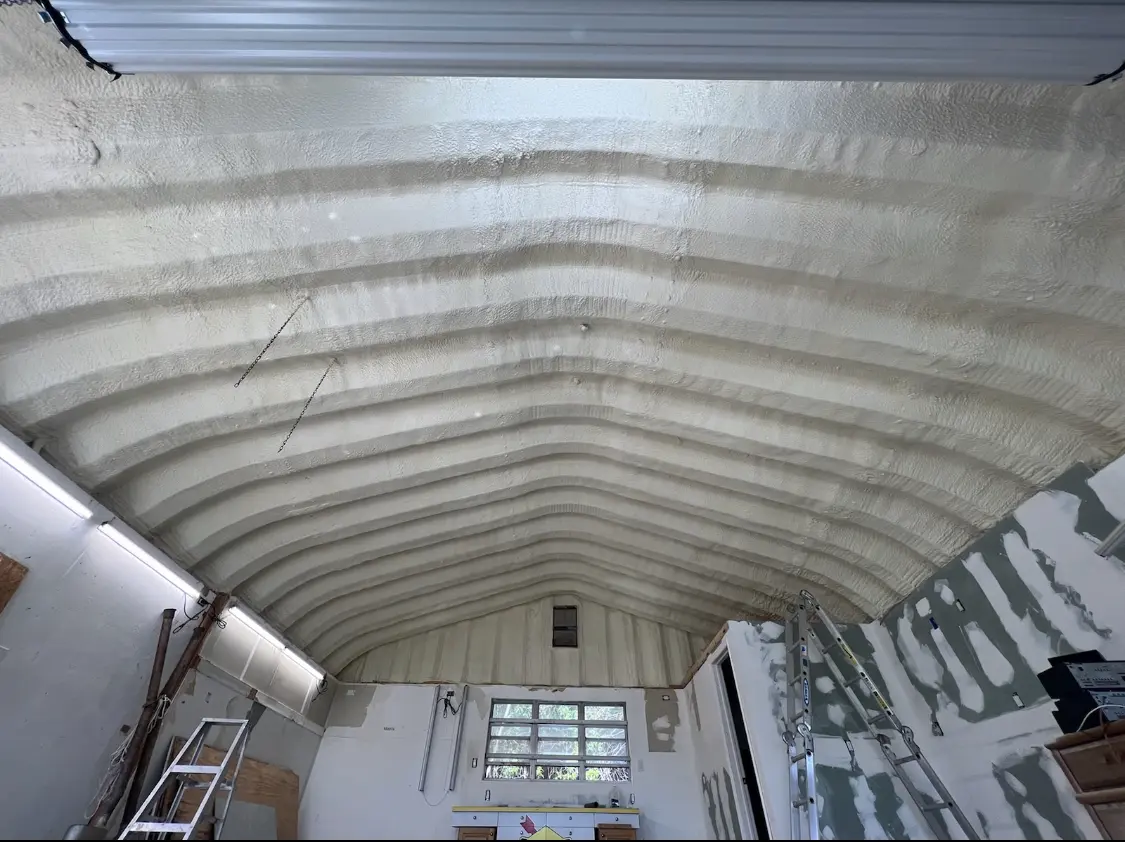 Spray polyurethane foam applied to the underside of a metal roof deck in Yucca Valley